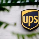 UPS employees standing in front of a delivery truck, symbolizing new job opportunities