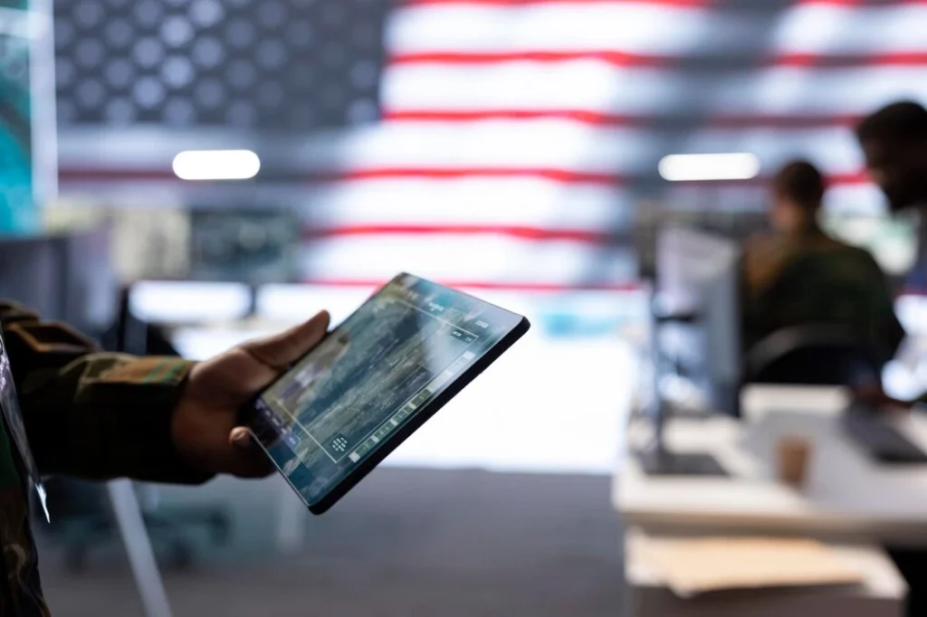 Person holding a Real ID-compliant driver's license with a star symbol