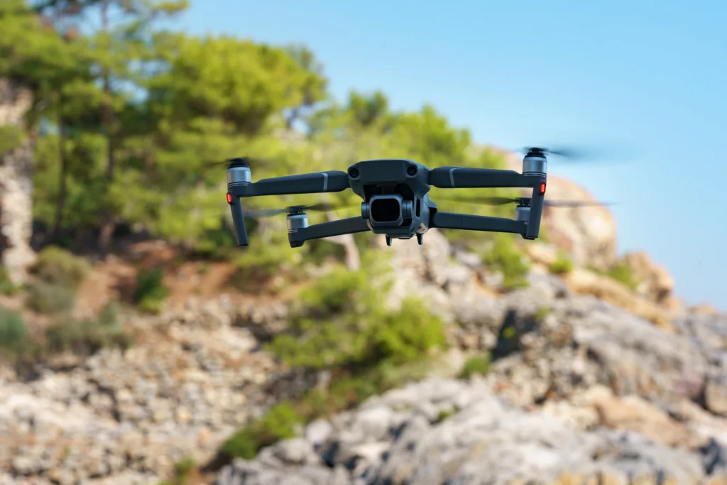 DJI Mavic 4 Pro drone flying in the sky with a scenic background