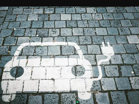 Futuristic electric cars charging at a solar-powered station in an American city