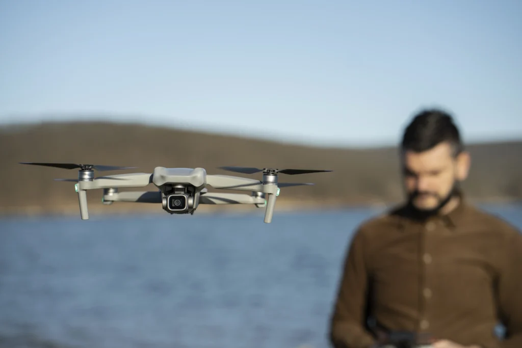 DJI Mavic 4 Pro drone flying in the sky with a scenic background