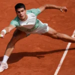 Carlos Alcaraz celebrates victory on the clay court at Roland Garros 2025