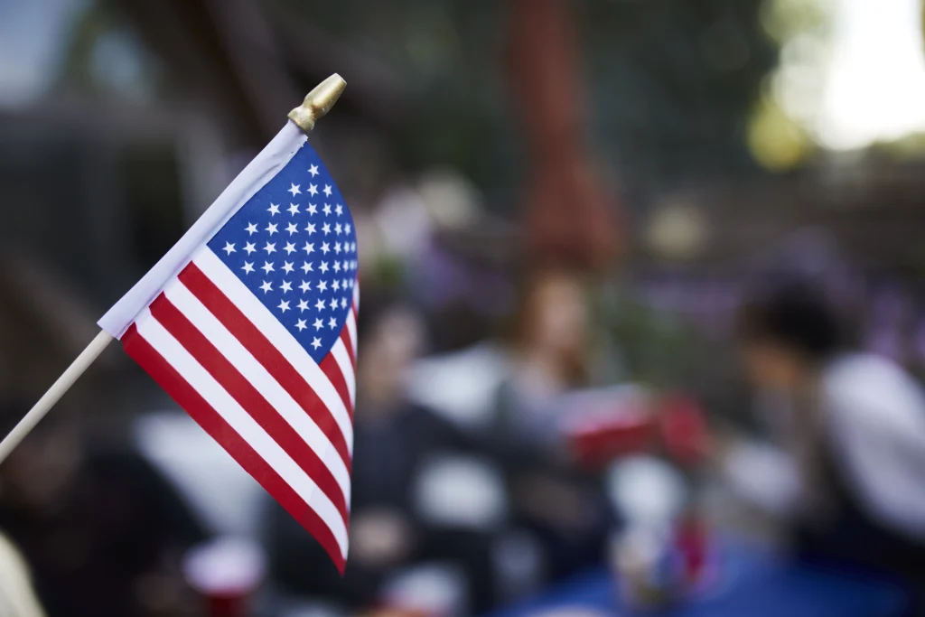 Soldiers march down Constitution Avenue during the U.S. Army’s 250th birthday parade in Washington, D.C., with flags, vehicles, and cheering crowds.