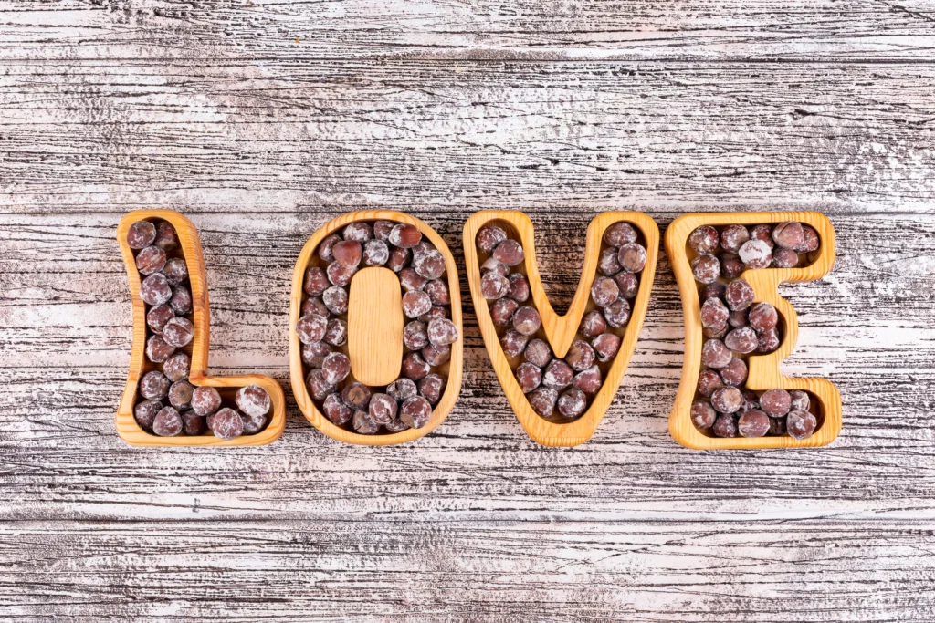 Image Alt Text (alt):
Assorted gourmet chocolates displayed on a rustic wooden table for World Chocolate Day.