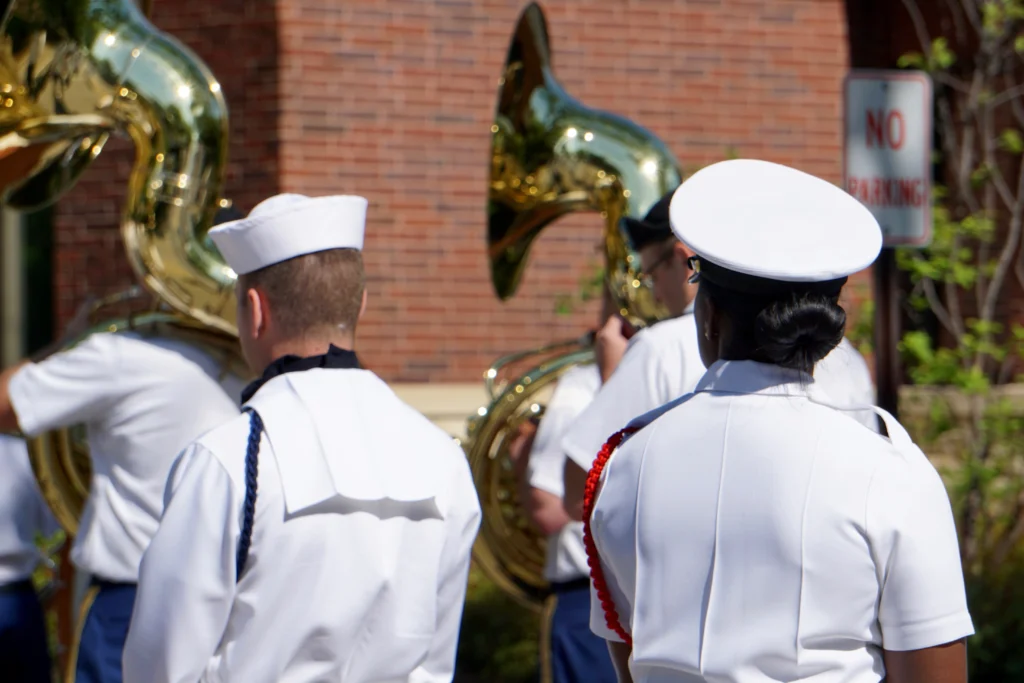 Coast Guard Day, August 4th, with a U.S. Coast Guard cutter patrolling at sea.
