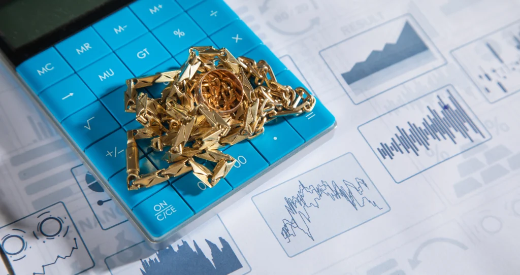 Gold bars stacked with a rising graph overlay symbolizing soaring gold prices amid global market turmoil.