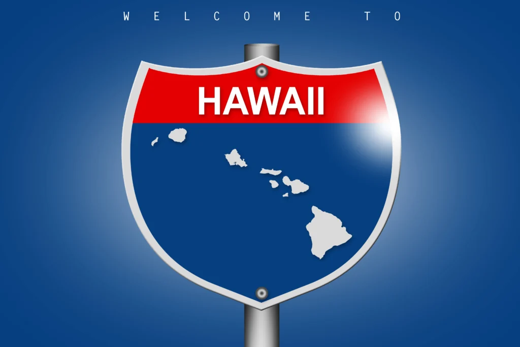 Hawaiian and American flags waving together during statehood celebration
