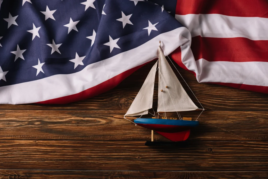 Coast Guard Day, August 4th, with a U.S. Coast Guard cutter patrolling at sea.