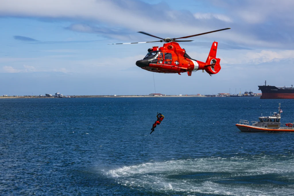 Coast Guard Day, August 4th, with a U.S. Coast Guard cutter patrolling at sea.