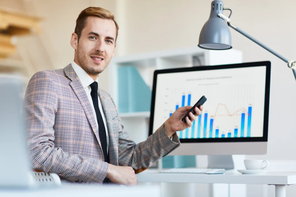 A business analyst analysing data and workflows on a laptop, representing how to start a BA career without prior experience