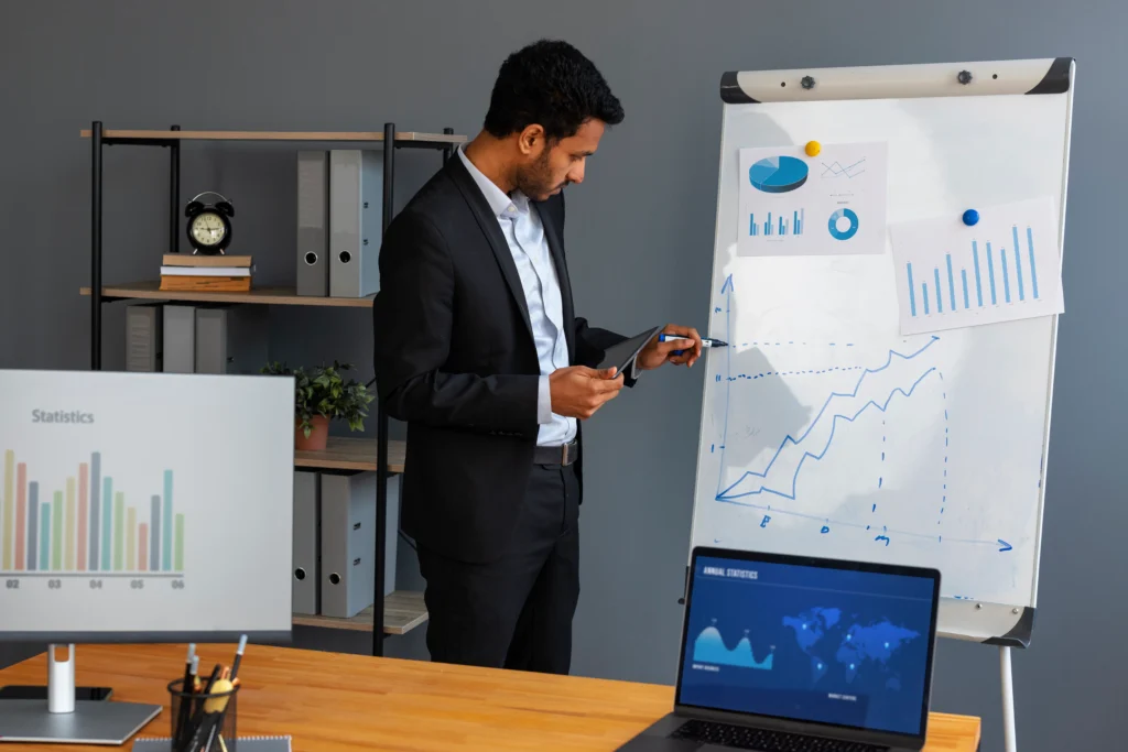 A business analyst analysing data and workflows on a laptop, representing how to start a BA career without prior experience