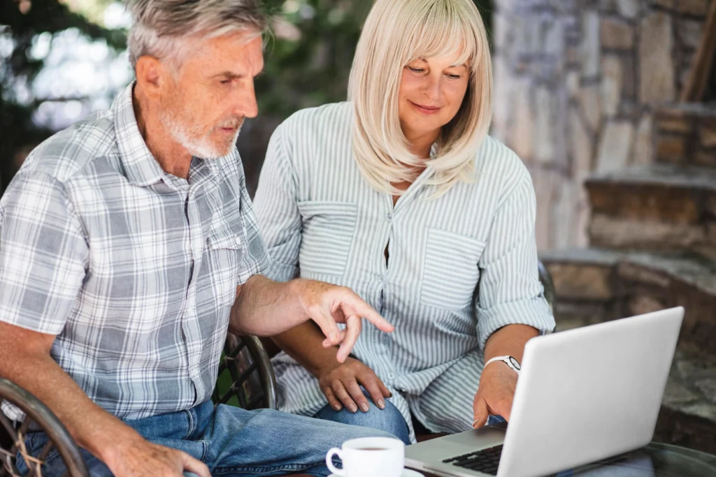 Elderly couple reviewing 2026 Social Security COLA increase documents at home