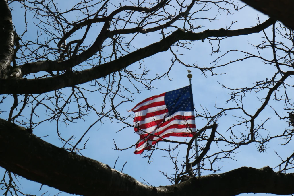 This image illustrates the spread of America’s “news deserts,” where local newspapers shut down and communities lose access to credible information. With empty streets and a closed newsroom, the scene reflects the growing threat to transparency, civic participation, and the health of local democracy.