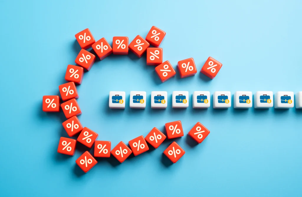 U.S. housing crisis showing high rent prices and tight credit pressure with a background of urban apartment buildings