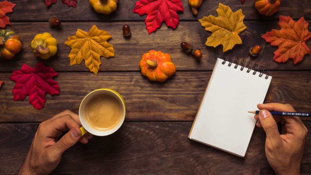 A beautifully decorated Friendsgiving table with autumn-themed decorations, cozy lighting, and a group of friends gathering for a festive meal.