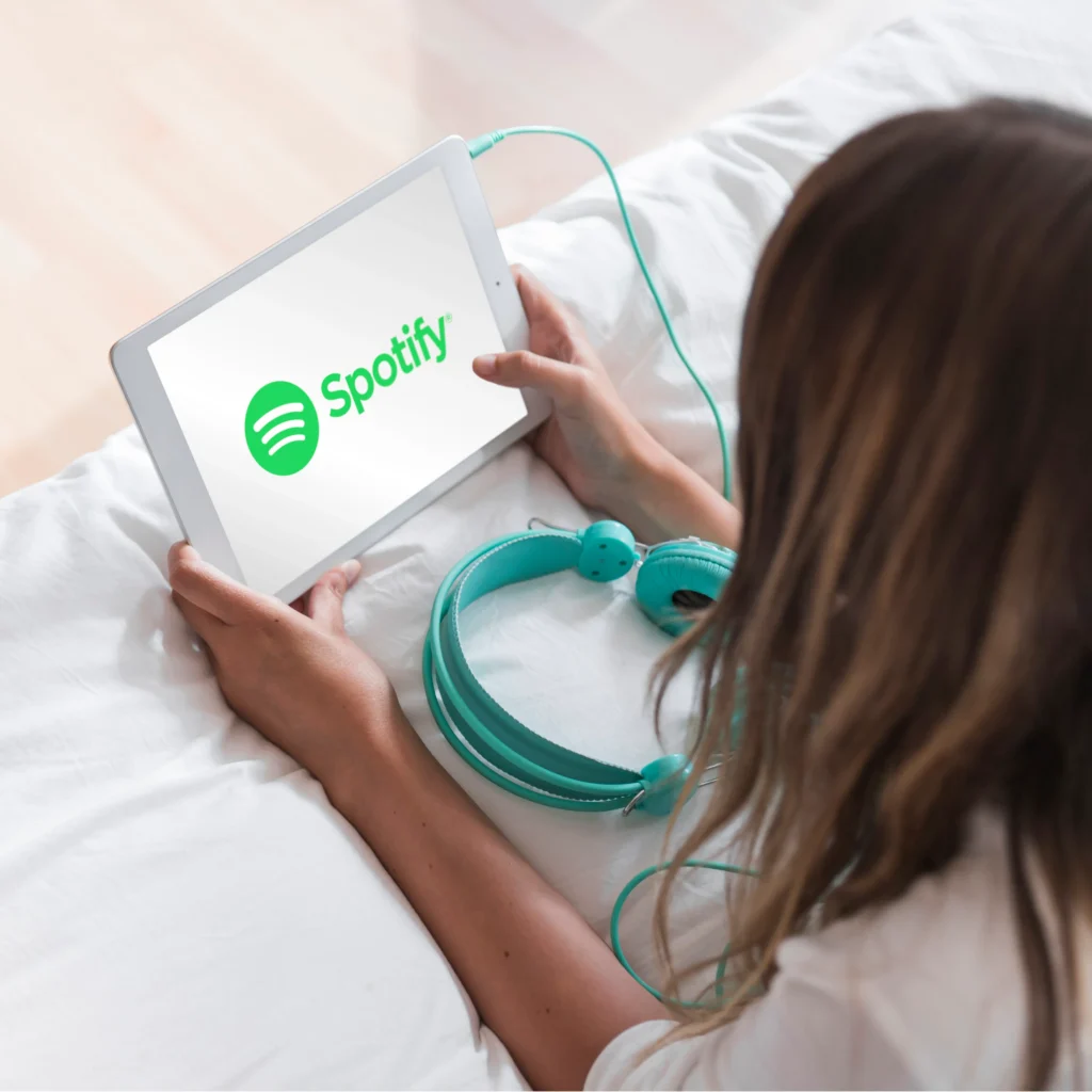 Spotify logo with a microphone symbolizing free speech and podcasting.