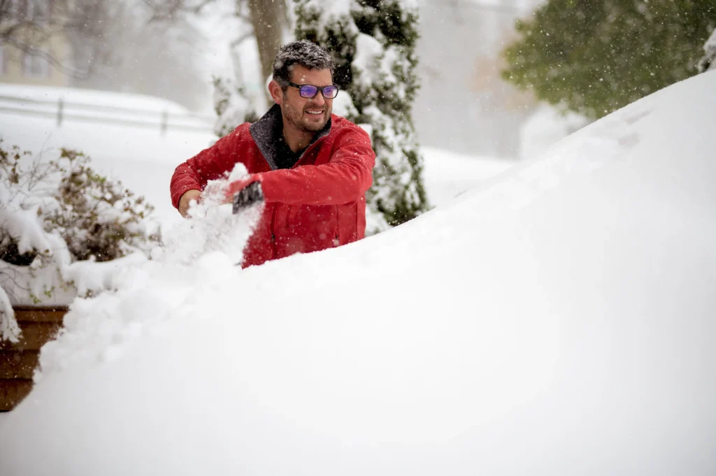 Historic winter storm covering U.S. cities with heavy snow, icy roads, and frozen landscapes