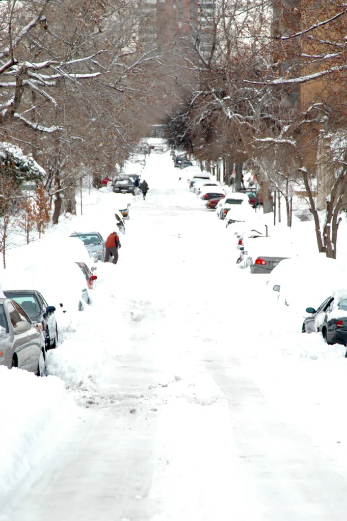 Historic winter storm covering U.S. cities with heavy snow, icy roads, and frozen landscapes