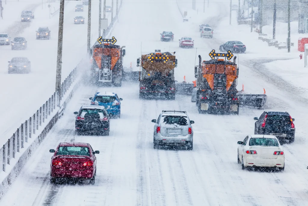 Historic winter storm covering U.S. cities with heavy snow, icy roads, and frozen landscapes
