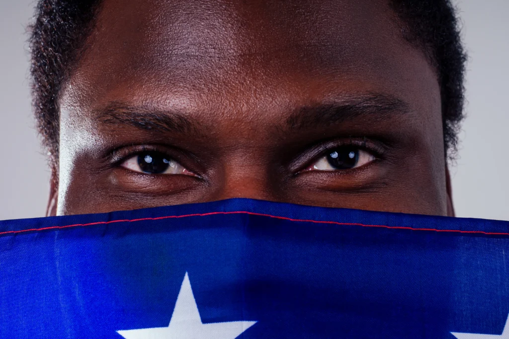 Protesters in Minneapolis hold signs and chant in streets demanding justice after an ICE agent fatally shot a woman, sparking national outrage.