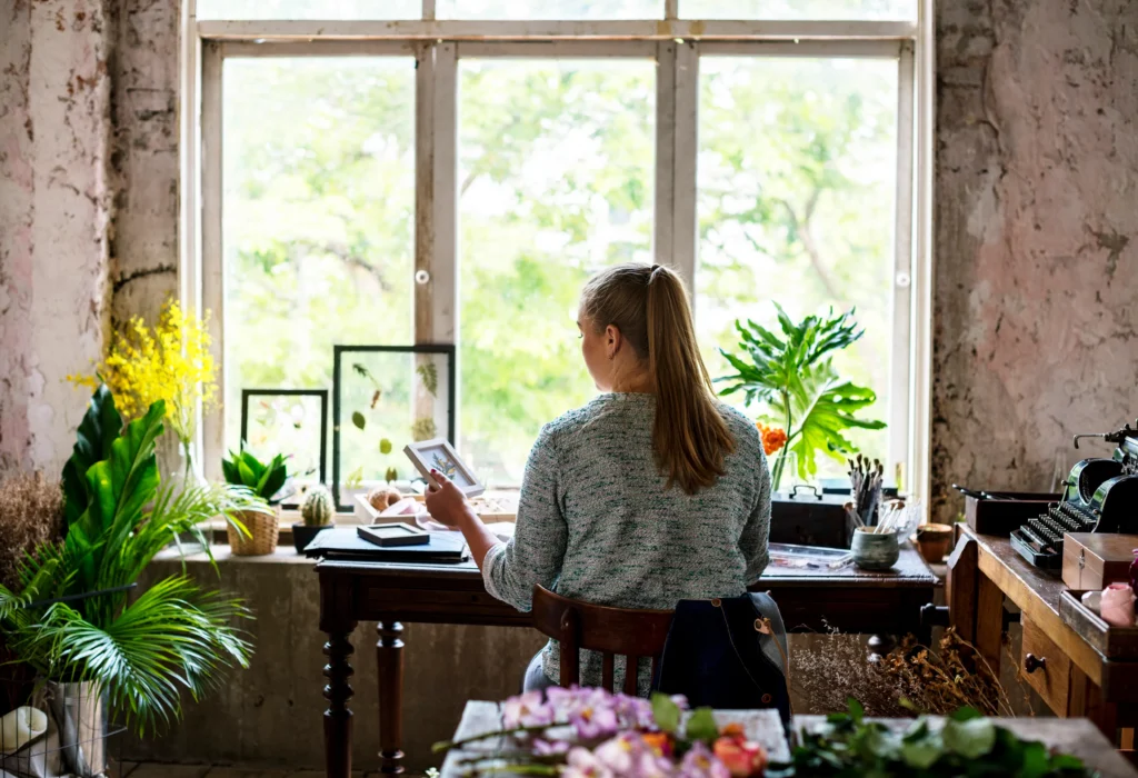 The Art of Slow Living
Person enjoying a peaceful slow living moment at home, surrounded by natural light, plants, and simple decor, reflecting a calm and intentional lifestyle.