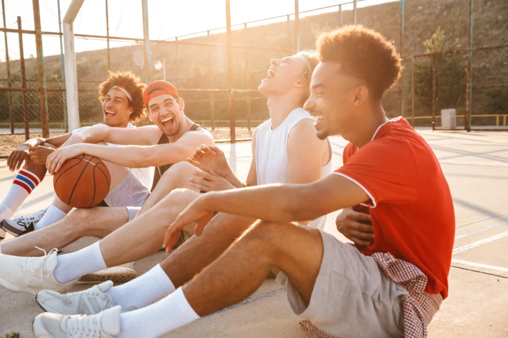 People playing sports outdoors, showing how physical activity helps reduce stress and improve mental health.