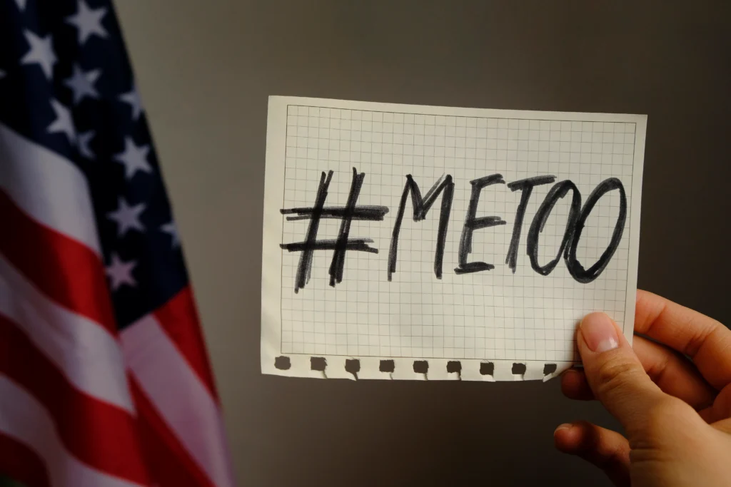 the #MeToo Movement protest with people holding signs, symbolizing the fight against sexual harassment and empowering survivors in Hollywood and beyond.