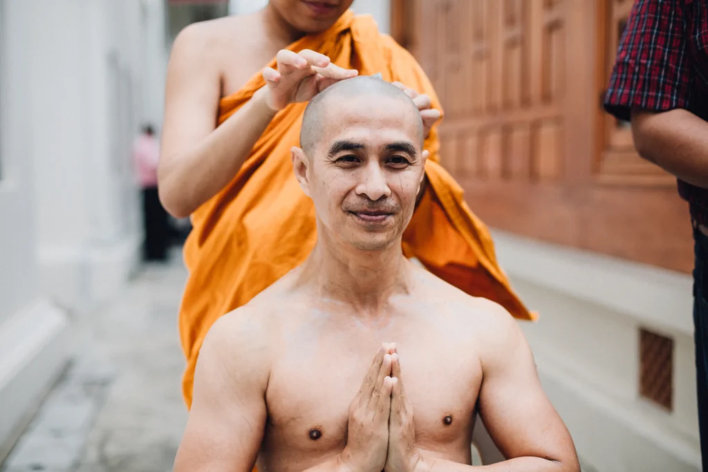 Buddhist monks walking along a U.S. roadside during the Walk for Peace Across the U.S., carrying calm presence and compassion.