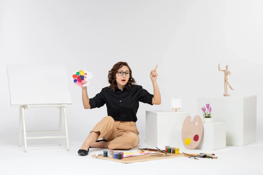 Single woman smiling on Valentine’s Day while enjoying self-care activities with flowers, chocolate, and a cozy atmosphere at home.
