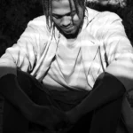 Lil Poppa performing on stage, Jacksonville rapper known for melodic hip-hop, honoring his legacy