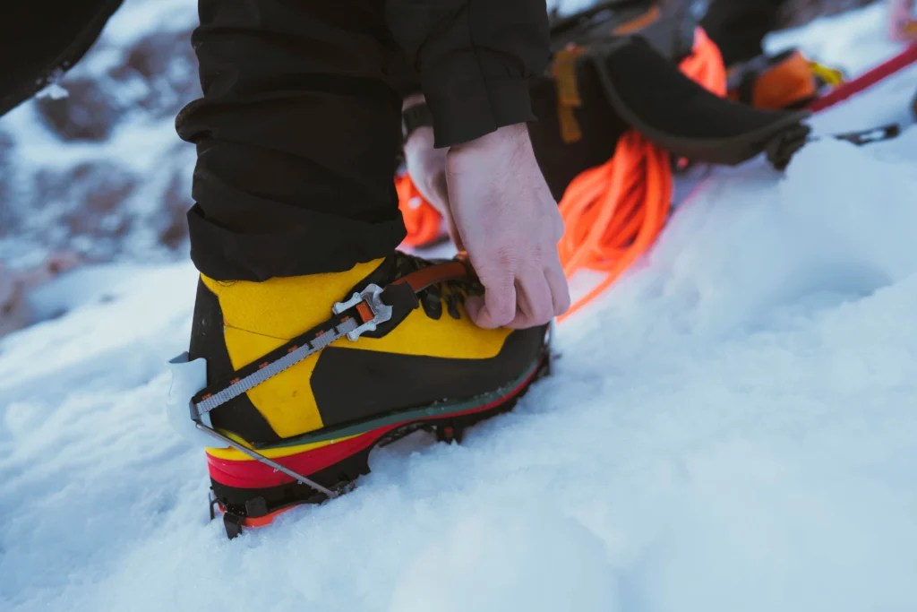 Skier wearing a helmet and carrying a first aid kit, ready for skiing safely