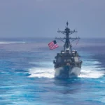 U.S. Navy ships USS Truxtun and USNS Supply operating at sea near South America