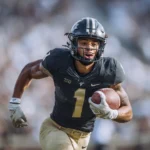 Portrait of NFL wide receiver during his football career, honoring his legacy after the tragic news.