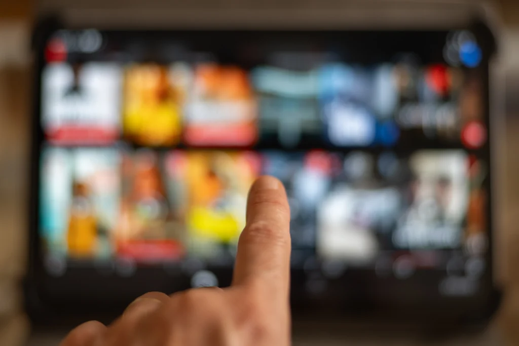 YouTube TV interface on a smart TV showing new subscription plans and improved streaming features.