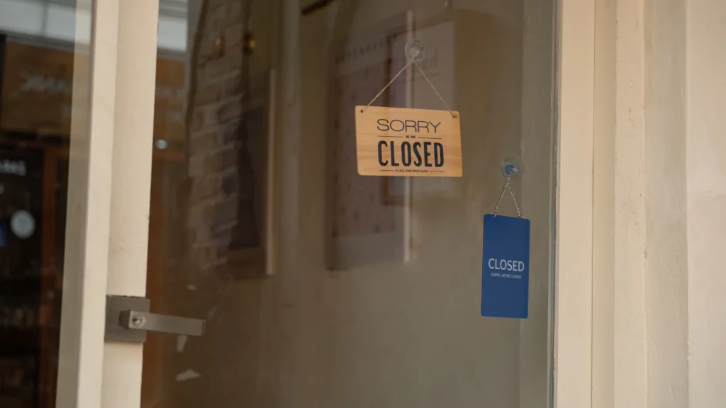 Social Security office building exterior with temporary closure notice and empty entrance doors