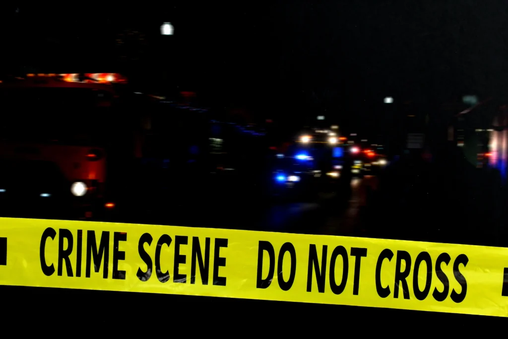 Police and emergency responders at the scene of a shooting in downtown Bloomington, Indiana near the university area at night
