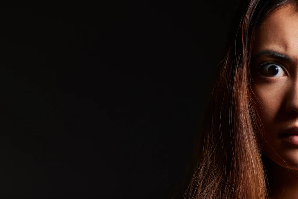 Deepfakes
AI-generated deepfake face blending realistic human features with digital distortion effects