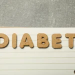 Person holding an Ozempic injection pen while looking thoughtful, symbolizing the discussion around Ozempic personality changes and mood effects.