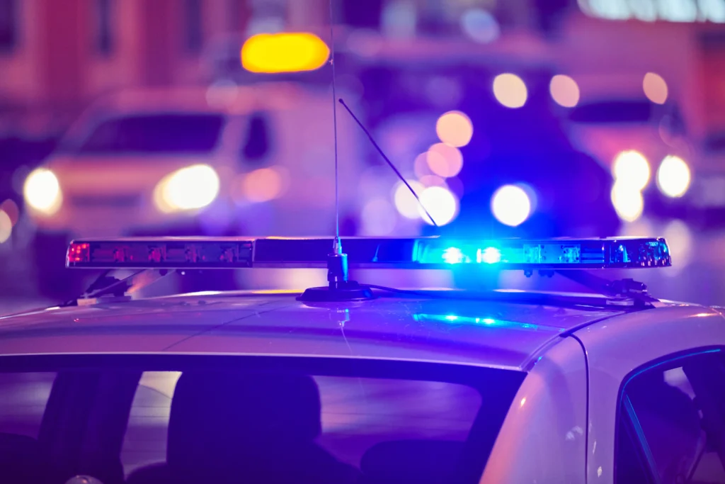 Police and emergency responders at the scene of a shooting in downtown Bloomington, Indiana near the university area at night