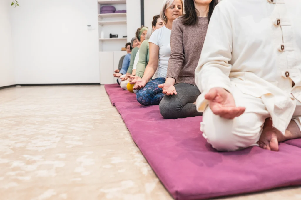 Person practicing simple meditation techniques for beginners in a calm, peaceful indoor setting