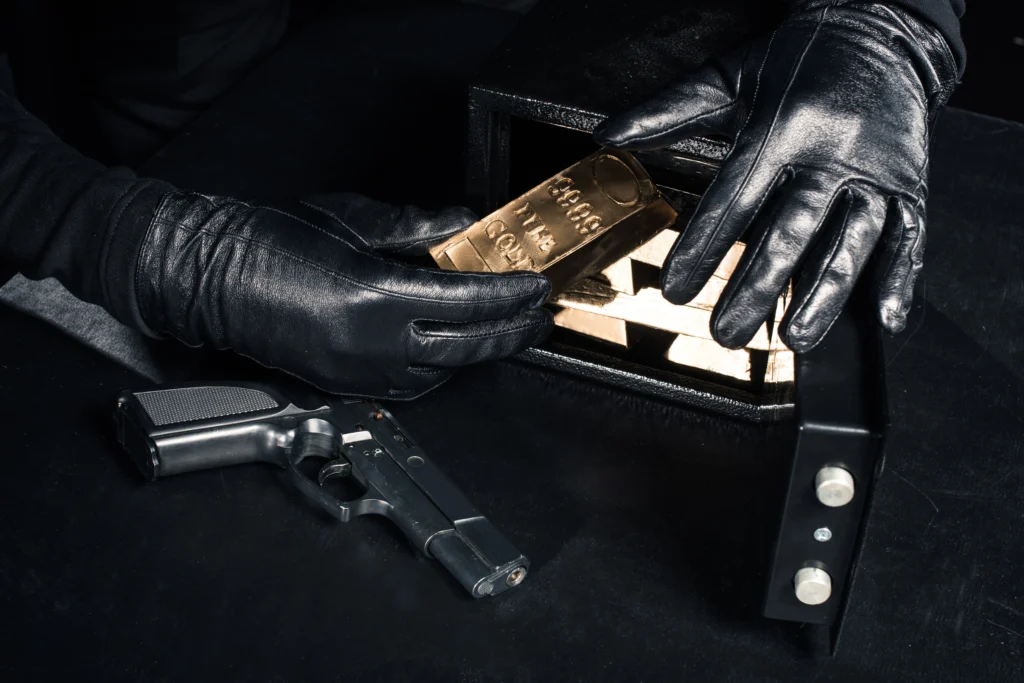FBI agents investigating a home where a former CIA official was arrested after $40 million in gold bars was discovered.