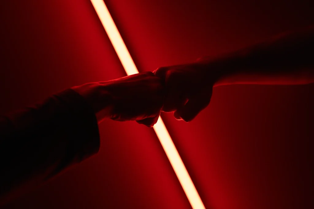 Jedi and Sith facing each other with glowing blue and red lightsabers, symbolizing the clash between light and dark sides of the Force