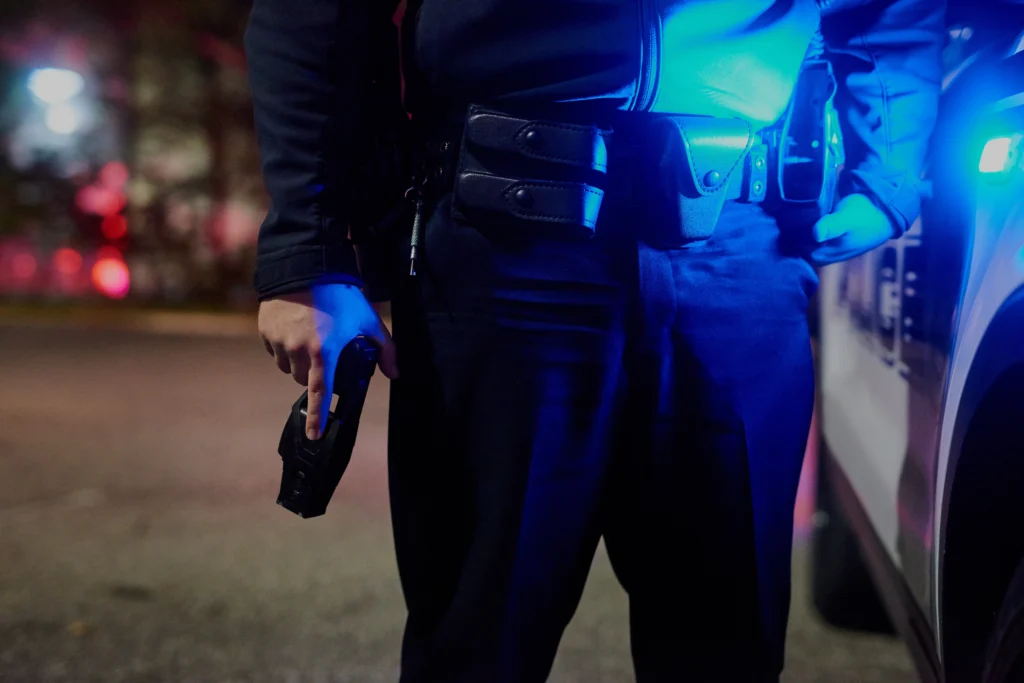 ICE agent arrested in Texas after Minneapolis shooting case, law enforcement officers escort suspect into custody during federal investigation