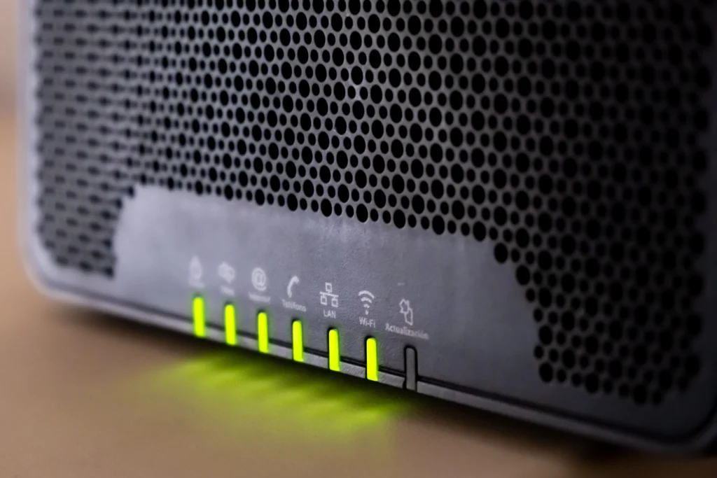 Routers
Cybersecurity warning showing a home Wi-Fi router under digital cyber attack threats