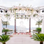 Donald Trump Jr. and Bettina Anderson engagement-style wedding concept in a private Bahamas island setting with tropical beach background