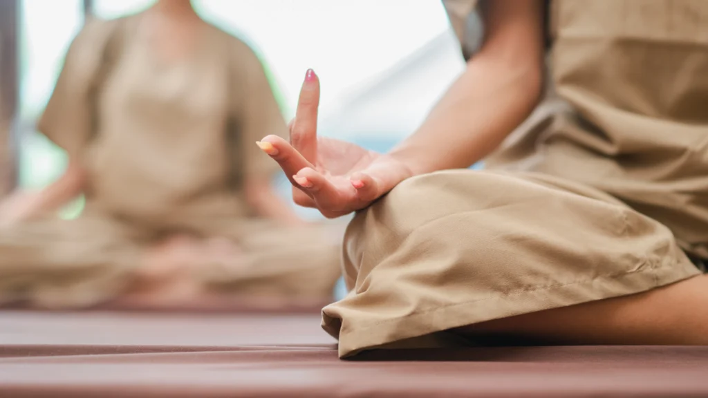 Person practicing simple meditation techniques for beginners in a calm, peaceful indoor setting