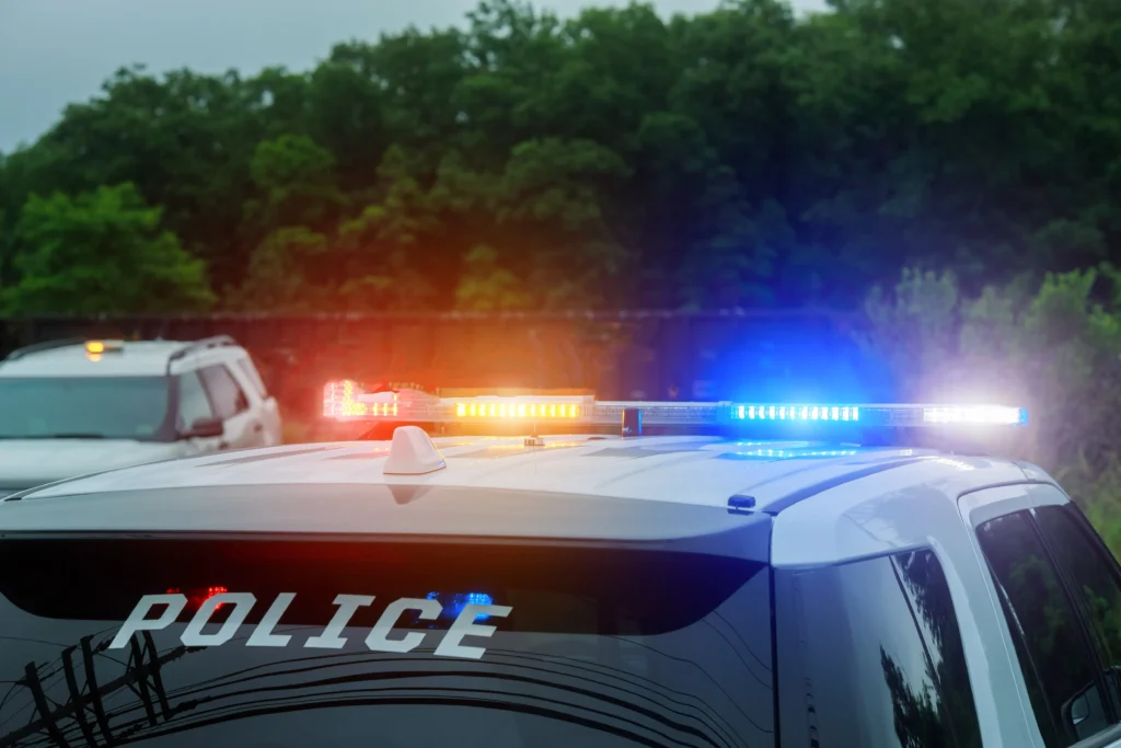 Police vehicles and emergency responders gather near the scene of a mass shooting in Midland, Texas, where one person was killed and ten others were injured.