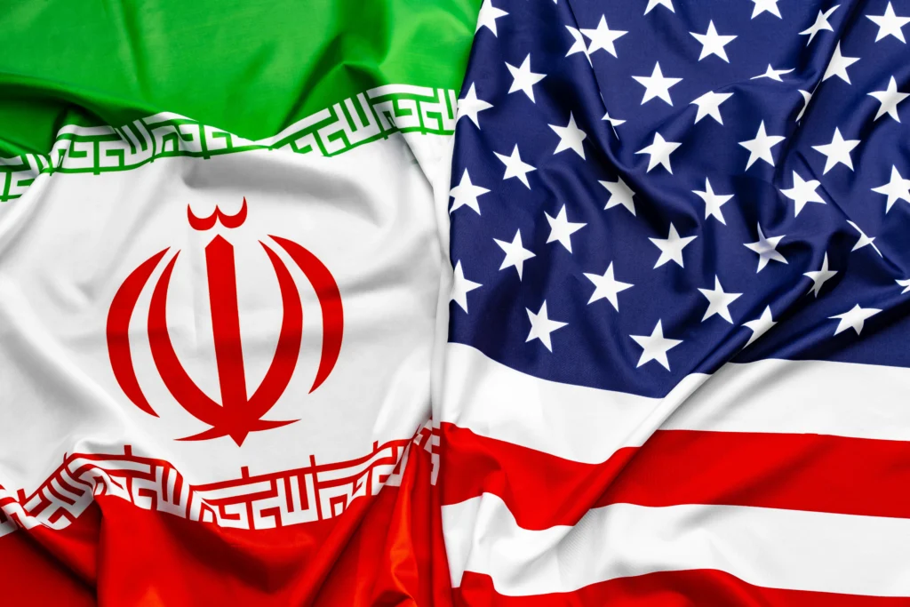 Delegates from the United States and Iran meeting in Switzerland during diplomatic talks, symbolizing rising global tensions and international negotiations.