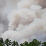 Michigan skyline covered by wildfire smoke during an air quality alert with hazy skies
