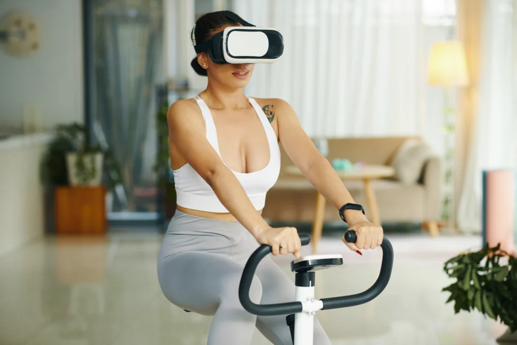 Person wearing a virtual reality headset while performing an interactive fitness workout in a modern gym, with digital workout metrics and immersive virtual environments displayed around them.